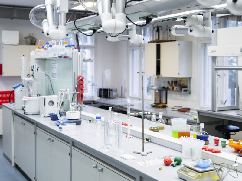 Laboratory room interior in modern research institute. Chemistry laboratory interior with scientific experiment equipment.